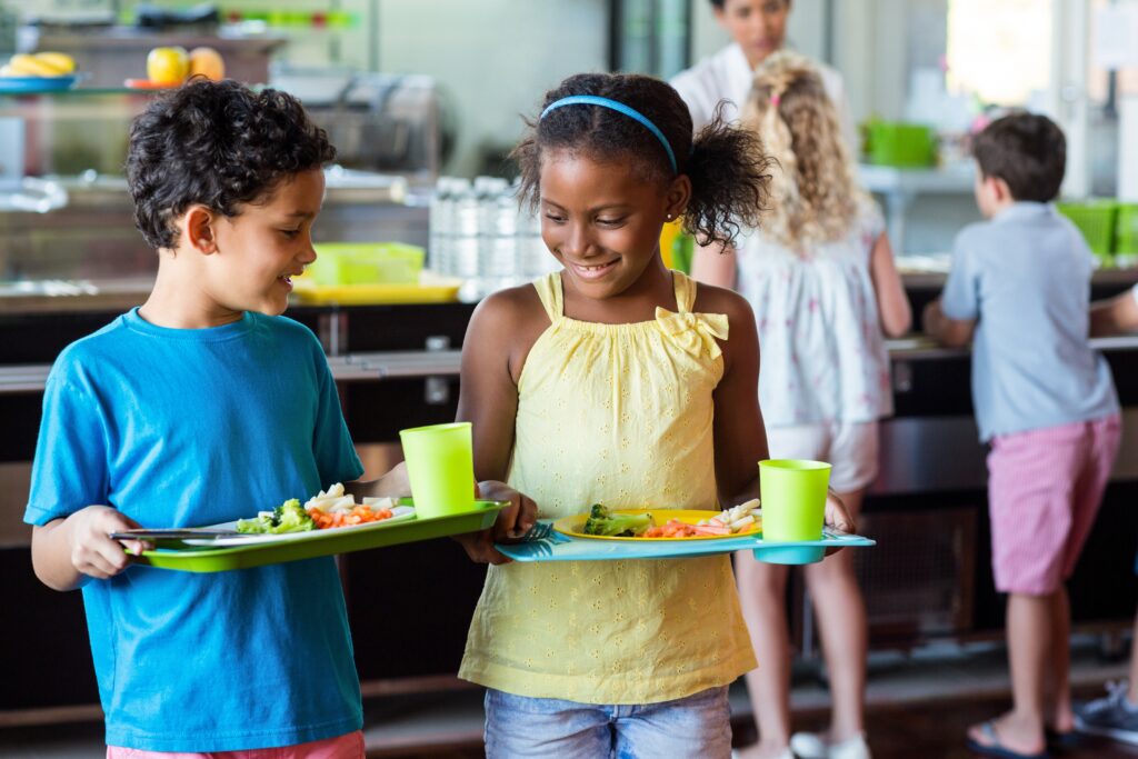 Children holding healthy lunch trays that have been minimally processed or unprocessed food that is  ‘locally grown,’ ‘locally raised,’ or ‘locally caught.’

by: WavebreakmediaMicro