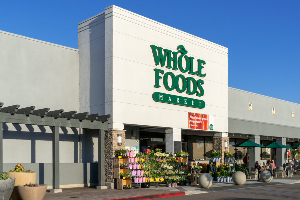 outside of a Whole Foods Market exterior and logo. Whole Foods Market Inc. is an American supermarket chain.
