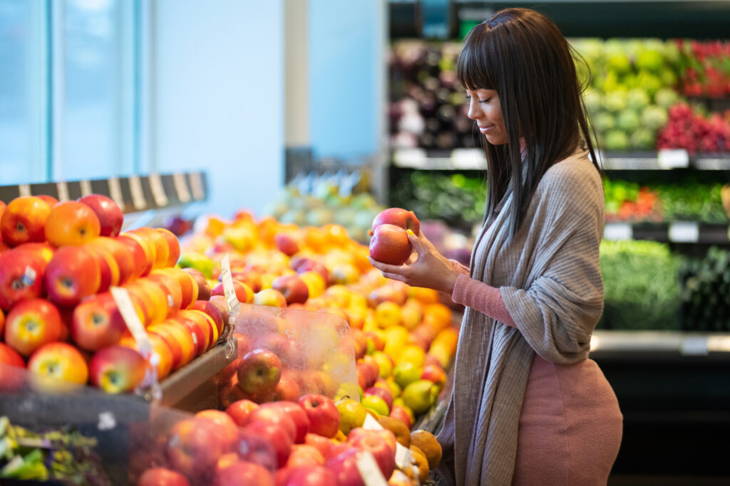 Woman shopping for apples in the produce department of a grocery store

By Mat Hayward