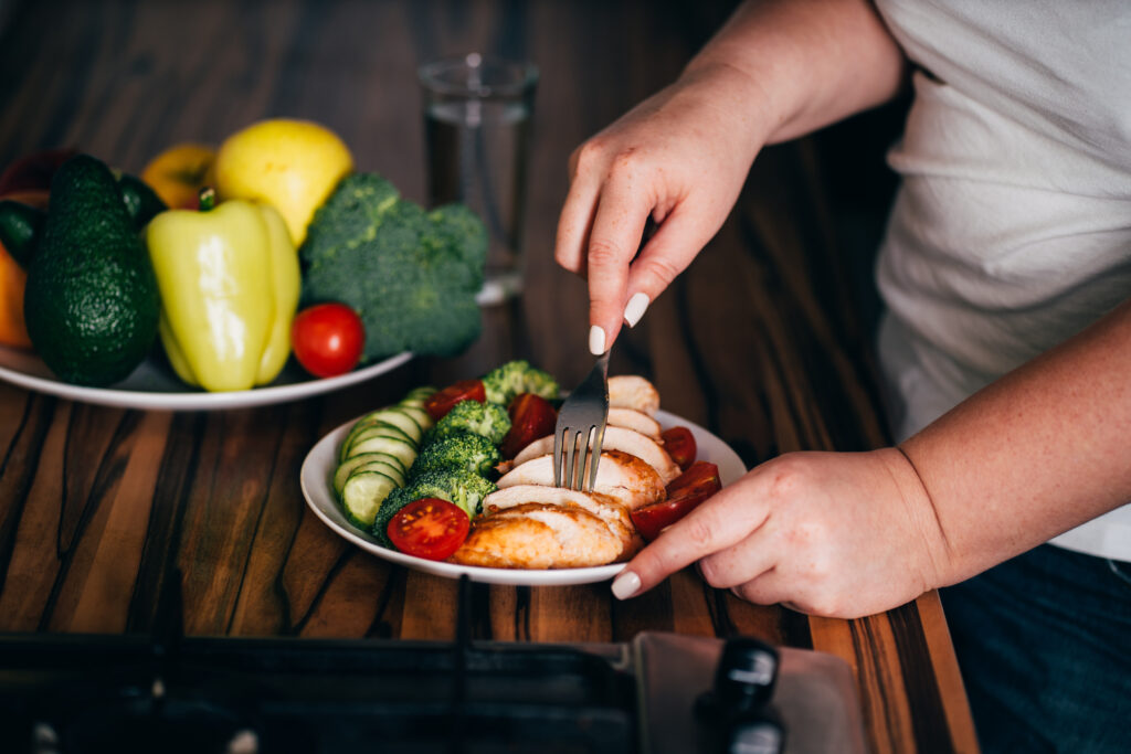 Diet concept, healthy lifestyle, low calorie food. Woman dieting. Closeup portrait of girl eating healthy food
By Vadym