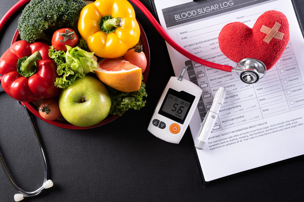 World diabetes day and healthcare concept. Patient's blood sugar control, diabetic measurement, and healthy food eating nutrition with red heart on black background. 
By Siam