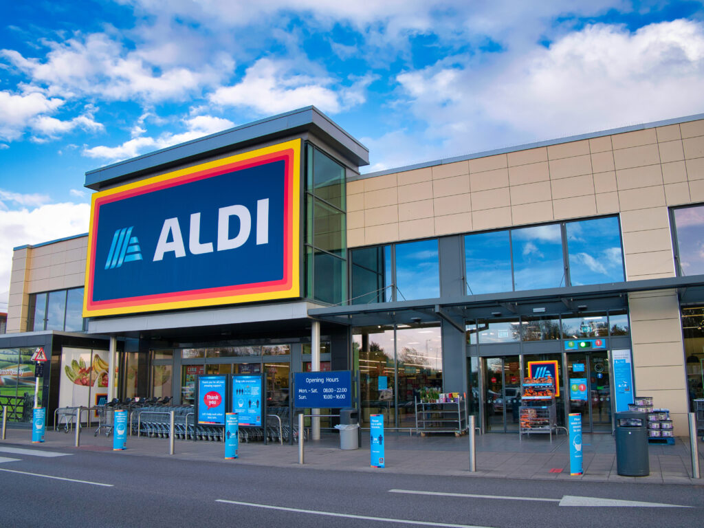 The frontage and brand logo of a branch of German discount retailer Aldi, taken in a local retail park on Wirral, UK on a sunny afternoon
By Alan