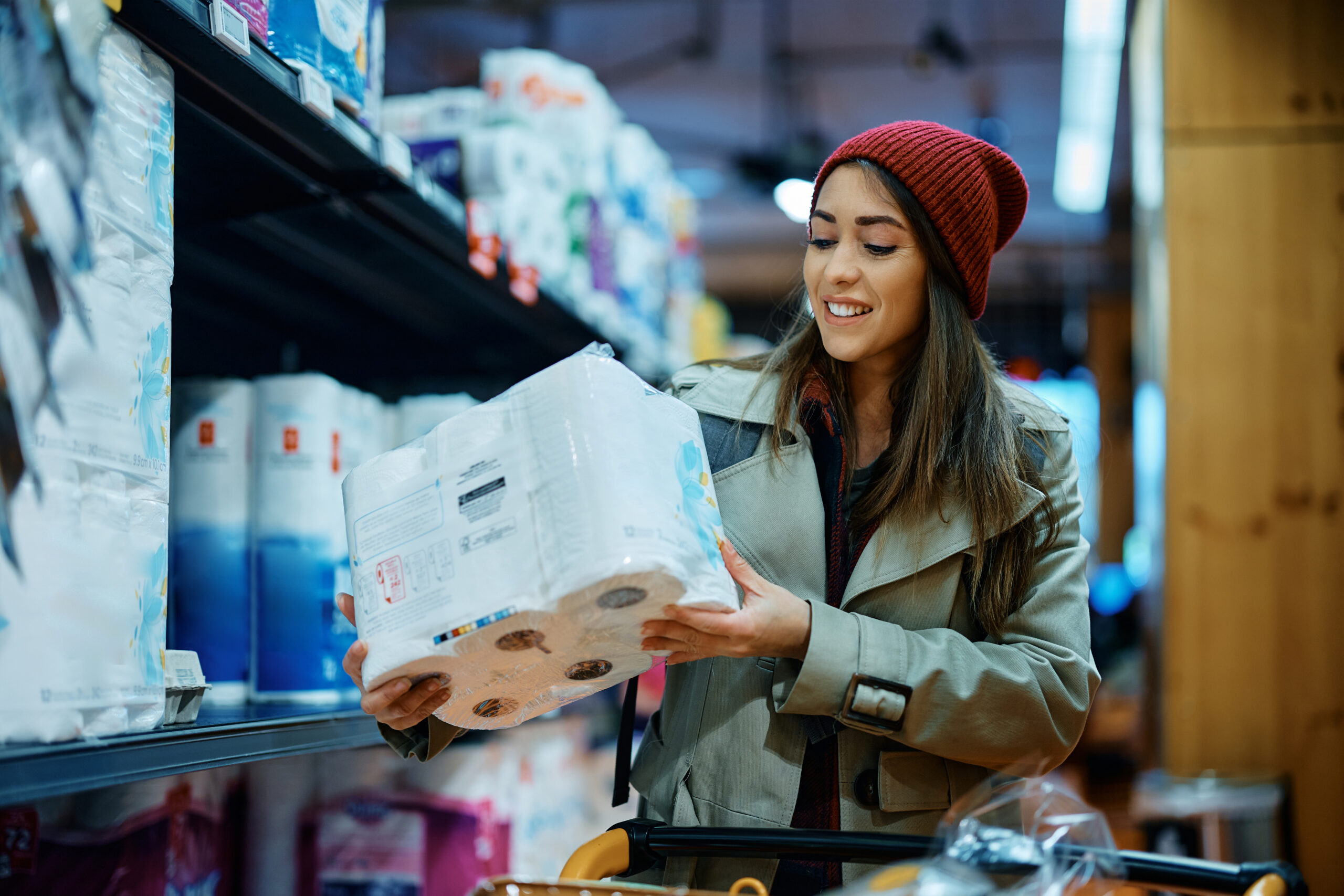 Happy woman buying toilet paper in supermarket.
By Drazen