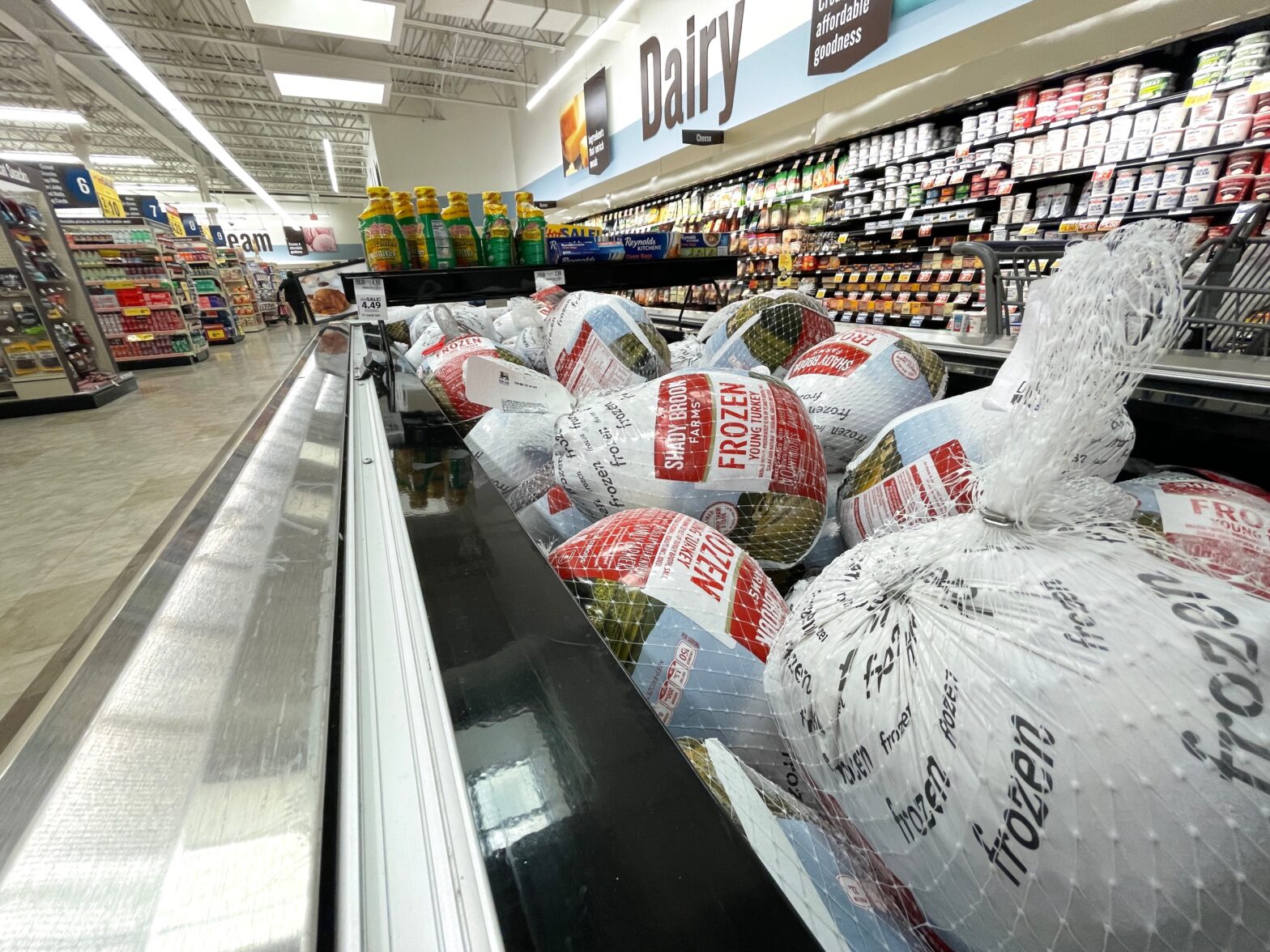 Grocery store frozen turkeys in a display case side view By billtster